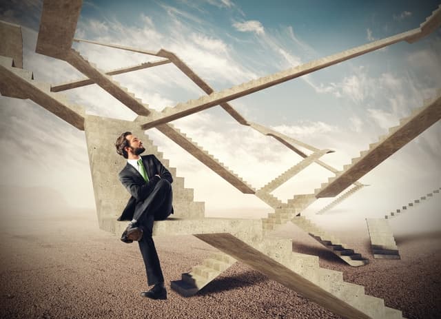 Man sitting on crazy steps